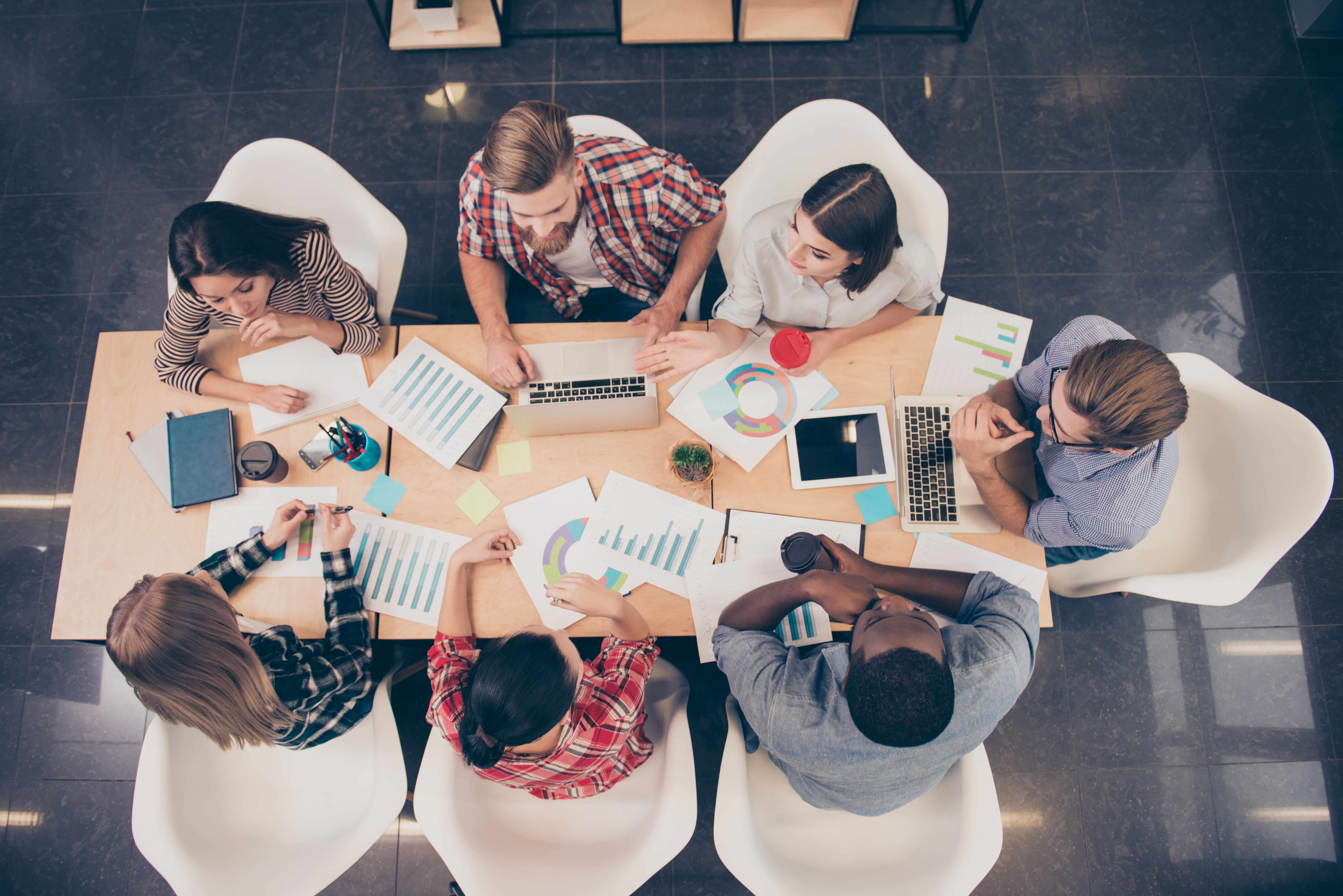 People sitting around a table photographed from high