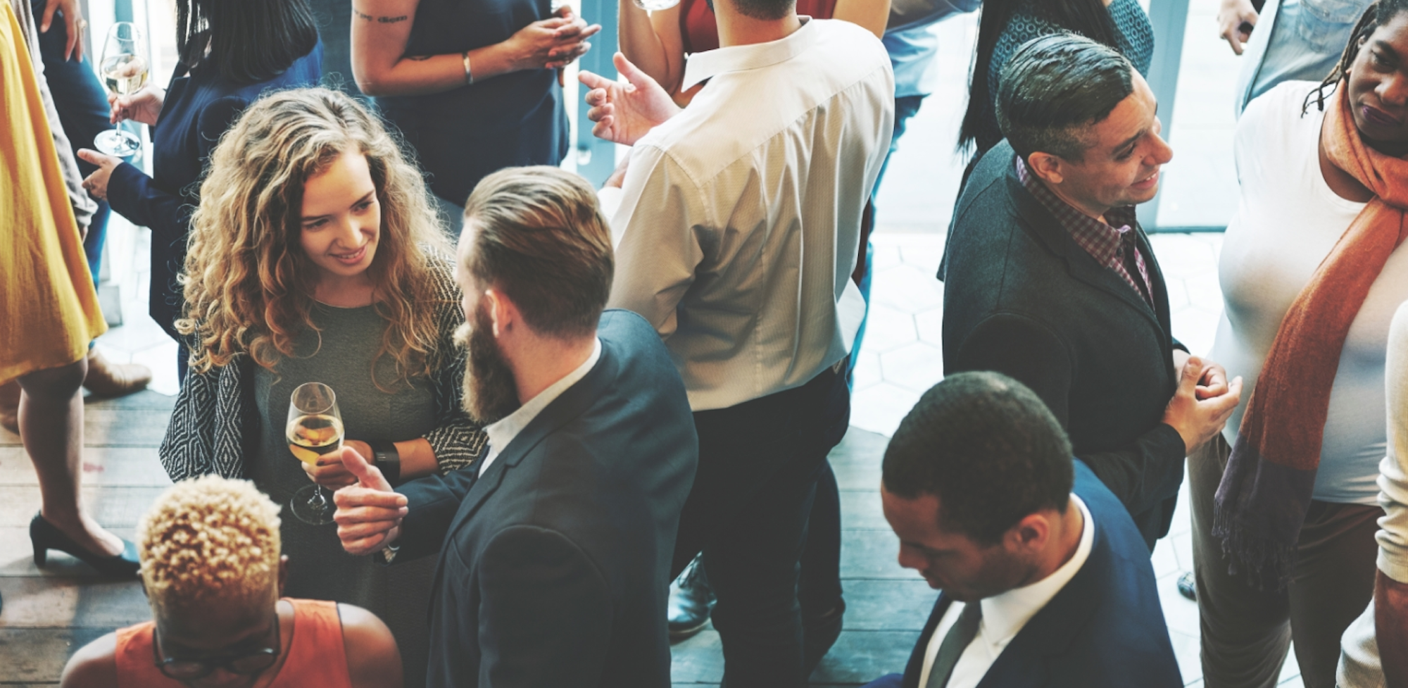 People talking at a reception.